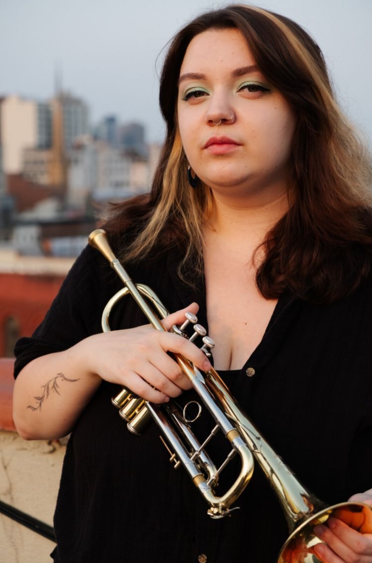 Alexandra Ridout holding trumpet
